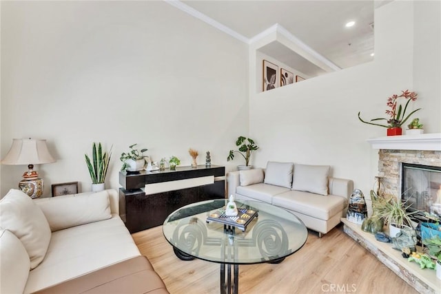 166 Alta St Unit B, Arcadia, CA 91006 - living area featuring crown molding, wood finished floors, a fireplace, and recessed lighting