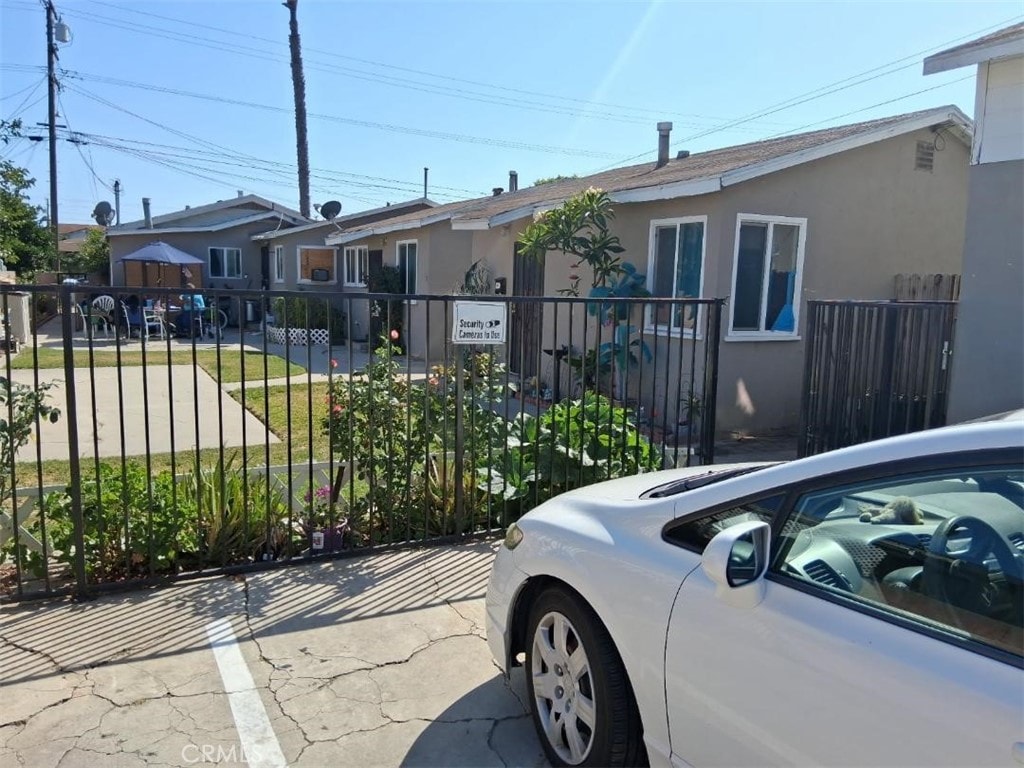 12043 Sycamore St, Norwalk, CA 90650 - ranch-style house with stucco siding and a gate