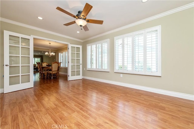 3238 San Amadeo Unit C, Laguna Woods, CA 92637 - unfurnished room with a chandelier, ornamental molding, light wood-type flooring, french doors, and ceiling fan