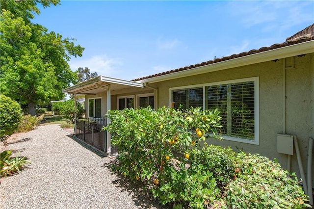 3238 San Amadeo Unit C, Laguna Woods, CA 92637 - view of side of property featuring stucco siding