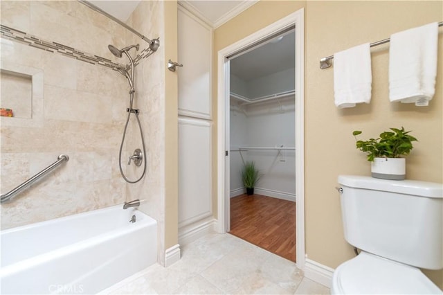 3238 San Amadeo Unit C, Laguna Woods, CA 92637 - bathroom featuring washtub / shower combination, crown molding, and a walk in closet