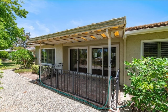 3238 San Amadeo Unit C, Laguna Woods, CA 92637 - property entrance with stucco siding and a patio area