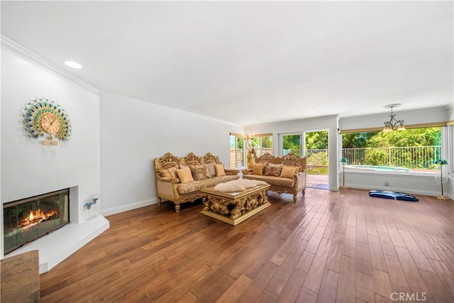 29212 Dean St, Laguna Niguel, CA 92677 - living room with wood finished floors, a glass covered fireplace, ornamental molding, and a chandelier