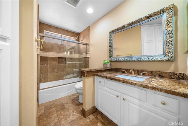 29212 Dean St, Laguna Niguel, CA 92677 - bathroom featuring vanity, shower / bath combination with glass door, and stone finish flooring