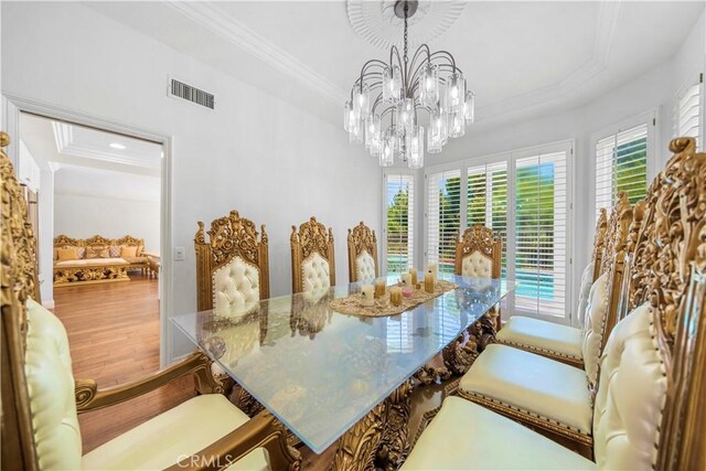 29212 Dean St, Laguna Niguel, CA 92677 - dining space featuring ornamental molding, wood finished floors, a chandelier, and a raised ceiling