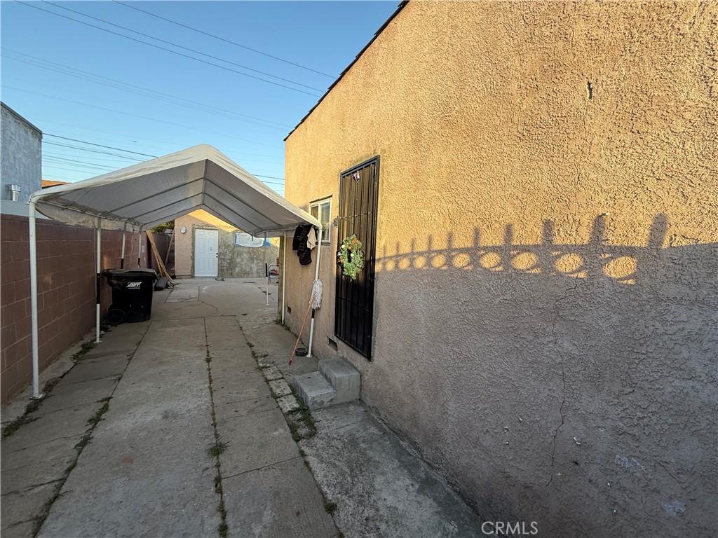 9418 Zamora Ave, Los Angeles, CA 90002 - view of property exterior featuring stucco siding and entry steps