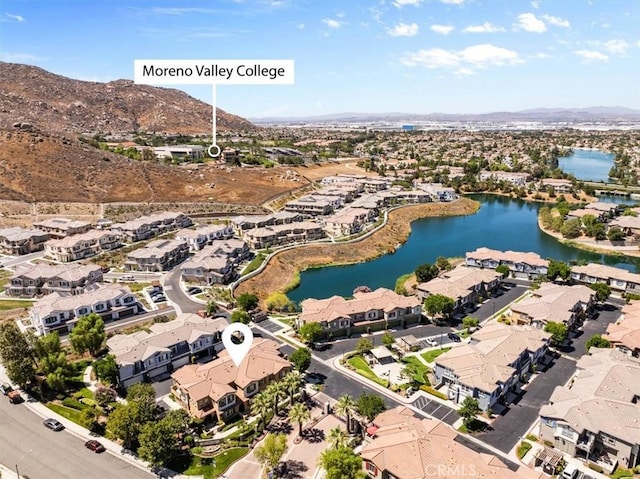 26327 Iris Ave Unit C, Moreno Valley, CA 92555 - aerial overview of property's location with nearby suburban area and a water and mountain view