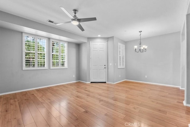 26327 Iris Ave Unit C, Moreno Valley, CA 92555 - empty room with a ceiling fan, a chandelier, light wood-style floors, and recessed lighting