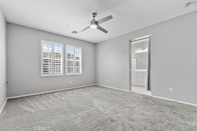 26327 Iris Ave Unit C, Moreno Valley, CA 92555 - unfurnished bedroom with carpet floors, ensuite bathroom, and a ceiling fan