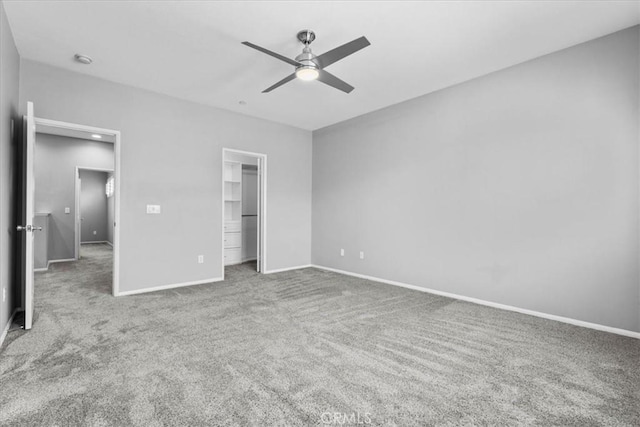 26327 Iris Ave Unit C, Moreno Valley, CA 92555 - unfurnished bedroom with carpet flooring, ceiling fan, and a spacious closet
