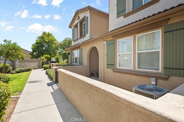 26327 Iris Ave Unit C, Moreno Valley, CA 92555 - view of side of home featuring a central AC unit and stucco siding