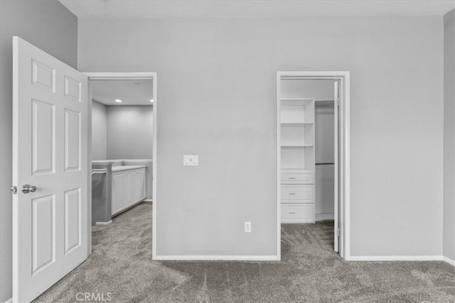 26327 Iris Ave Unit C, Moreno Valley, CA 92555 - unfurnished bedroom with a spacious closet and carpet flooring