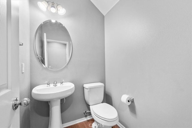 26327 Iris Ave Unit C, Moreno Valley, CA 92555 - half bathroom with toilet and wood finished floors