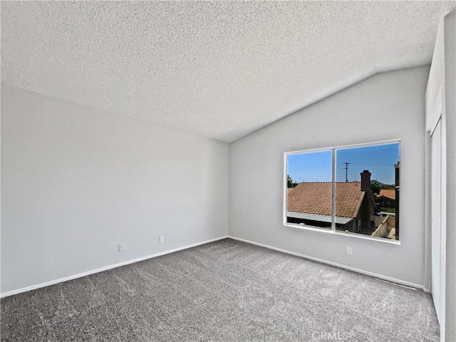 29923 Corte Cruzada, Menifee, CA 92584 - unfurnished room with lofted ceiling, carpet flooring, and a textured ceiling