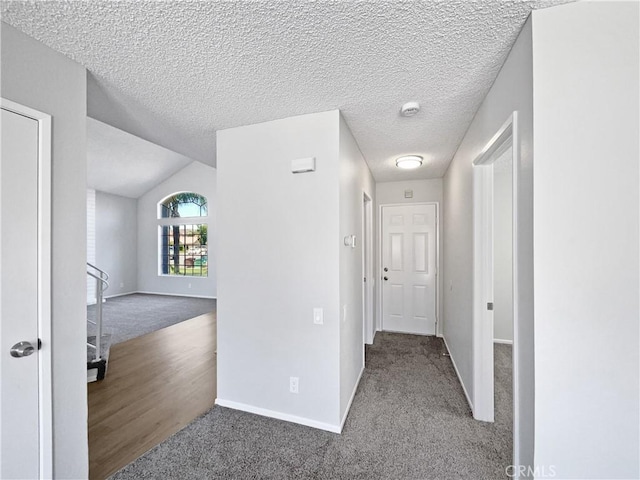 29923 Corte Cruzada, Menifee, CA 92584 - hall featuring carpet floors, vaulted ceiling, a textured ceiling, and an upstairs landing