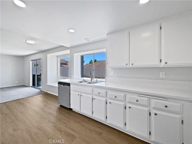 29923 Corte Cruzada, Menifee, CA 92584 - kitchen featuring dishwasher, white cabinetry, light countertops, wood finished floors, and recessed lighting