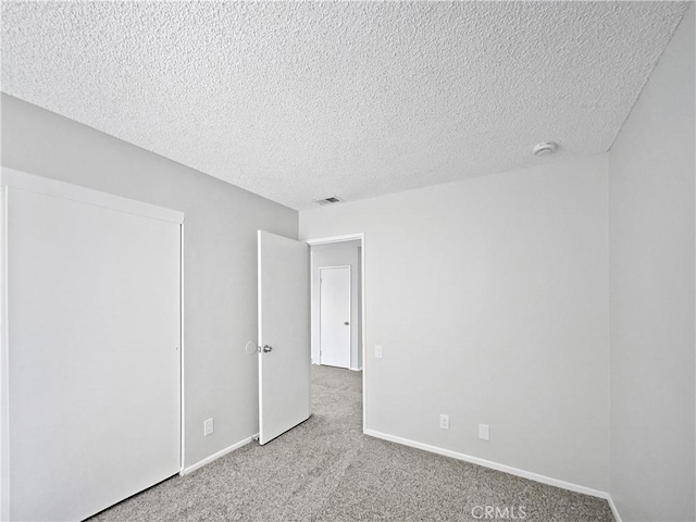 29923 Corte Cruzada, Menifee, CA 92584 - unfurnished room with carpet flooring, a textured ceiling, and a smoke detector