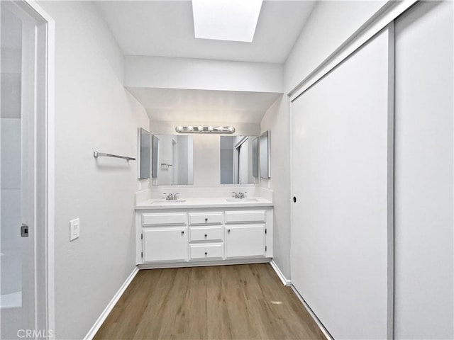 29923 Corte Cruzada, Menifee, CA 92584 - full bath featuring wood finished floors and double vanity