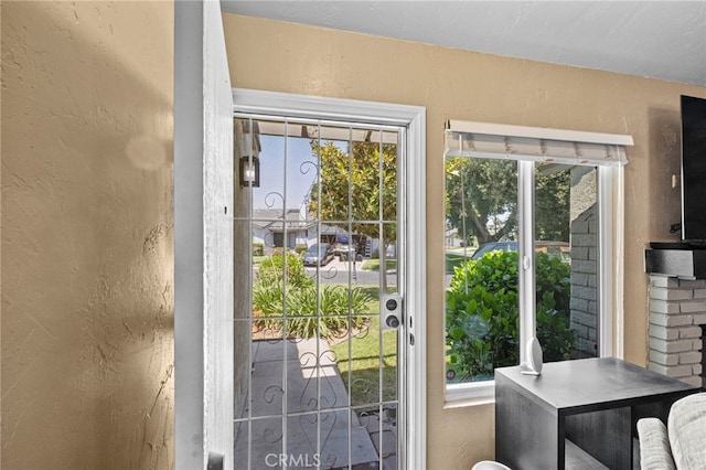 3197 Bexfield Ct, Riverside, CA 92503 - doorway featuring a textured wall and plenty of natural light