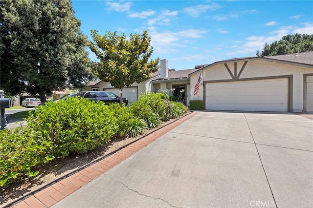 3197 Bexfield Ct, Riverside, CA 92503 - view of front of property with stucco siding, driveway, and a garage