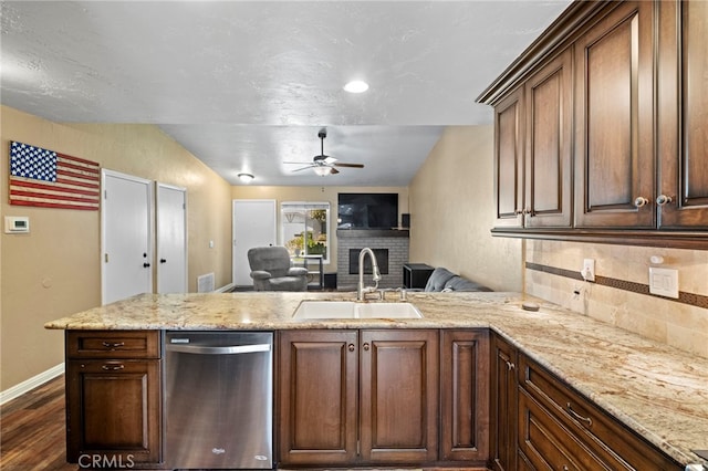 3197 Bexfield Ct, Riverside, CA 92503 - kitchen with dishwasher, a peninsula, a ceiling fan, open floor plan, and dark wood-type flooring