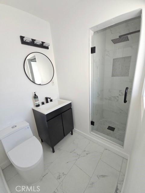 7927 Chastain Pl, Reseda, CA 91335 - full bath with marble look tiles, a stall shower, and vanity