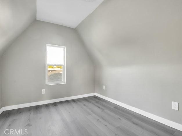 1438 W 69th St, Los Angeles, CA 90047 - bonus room featuring wood finished floors and vaulted ceiling