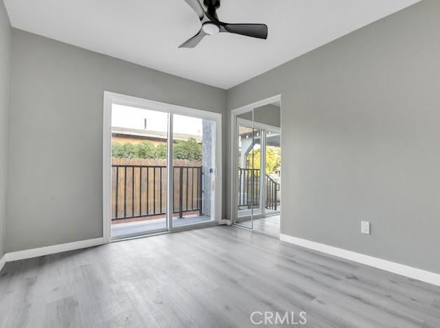 1438 W 69th St, Los Angeles, CA 90047 - empty room with wood finished floors and ceiling fan