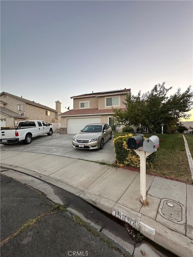 15654 Enfield Dr, Victorville, CA 92394 - view of front of house with a garage and driveway