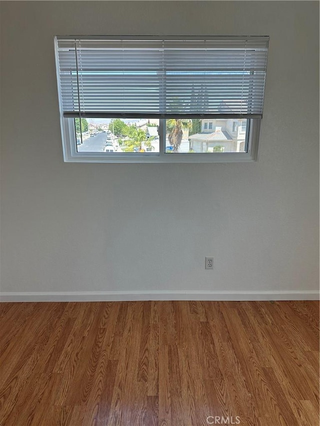 15654 Enfield Dr, Victorville, CA 92394 - spare room with wood finished floors and plenty of natural light