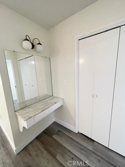 28838 Snead Dr, Menifee, CA 92586 - bathroom with wood finished floors and baseboards