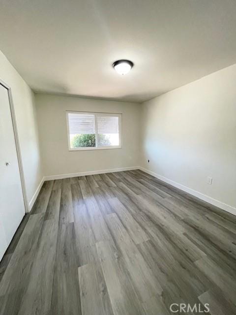 28838 Snead Dr, Menifee, CA 92586 - empty room with baseboards and dark wood finished floors