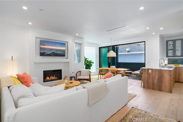 6191/2 Marguerite, Corona Del Mar, CA 92625 - living room featuring light wood-style flooring, a glass covered fireplace, and recessed lighting