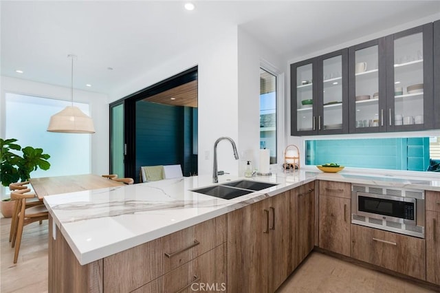 6191/2 Marguerite, Corona Del Mar, CA 92625 - kitchen with stainless steel microwave, light stone countertops, glass insert cabinets, modern cabinets, and recessed lighting