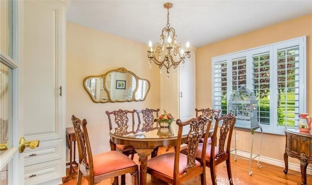 856 Ardmore Cir, Redlands, CA 92374 - dining area featuring a chandelier and light wood-style flooring