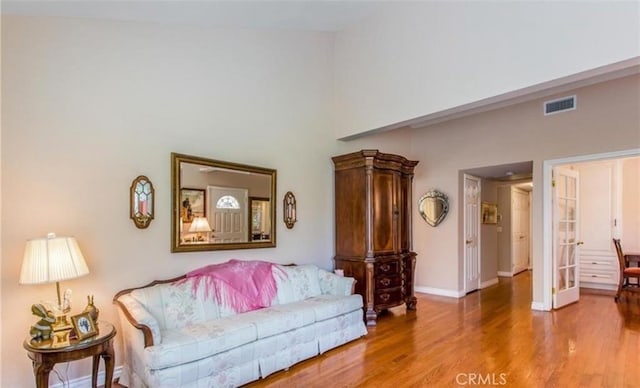 856 Ardmore Cir, Redlands, CA 92374 - living area with wood finished floors, a towering ceiling, and french doors