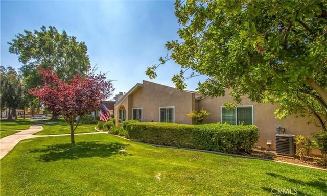 856 Ardmore Cir, Redlands, CA 92374 - view of property exterior with a lawn and stucco siding