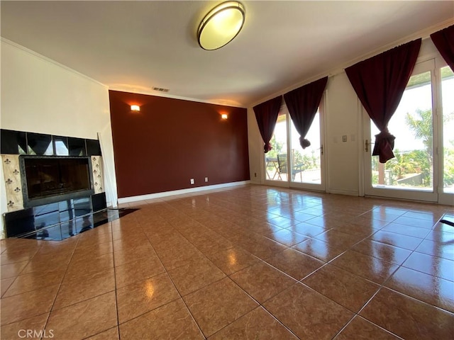 13761 Lomitas Ave, La Puente, CA 91746 - unfurnished living room featuring tile patterned flooring, crown molding, and a tile fireplace