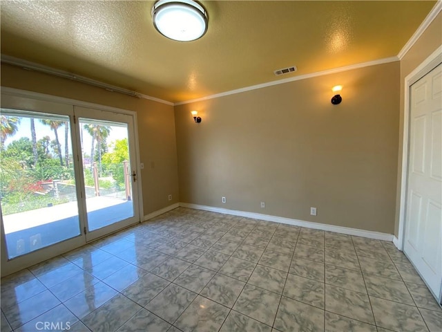 13761 Lomitas Ave, La Puente, CA 91746 - spare room with crown molding, a textured ceiling, and tile patterned floors
