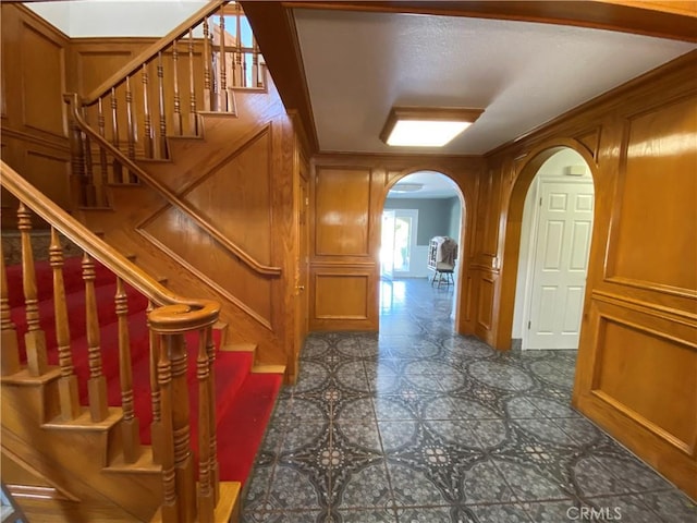 13761 Lomitas Ave, La Puente, CA 91746 - stairs with arched walkways, a decorative wall, and tile patterned floors