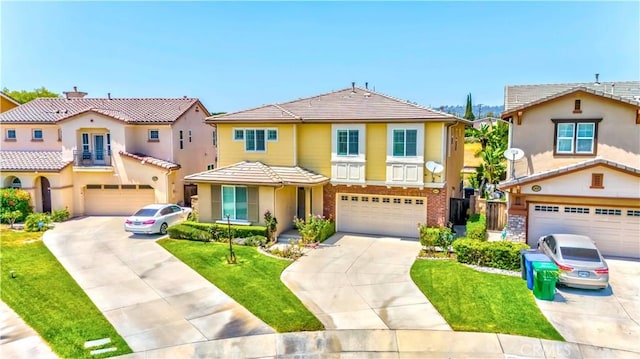 1411 W Dahlia St, La Habra, CA 90631 - view of front of home featuring an attached garage, concrete driveway, a tiled roof, a front yard, and stucco siding
