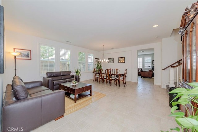 1411 W Dahlia St, La Habra, CA 90631 - living room featuring a chandelier, plenty of natural light, stairs, and recessed lighting