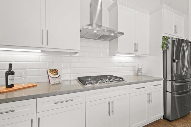 2035 Bravo Loop Unit 6, Chula Vista, CA 91915 - kitchen with stainless steel appliances, wall chimney range hood, white cabinetry, light stone countertops, and backsplash