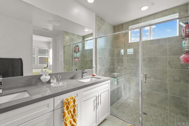 2035 Bravo Loop Unit 6, Chula Vista, CA 91915 - bathroom featuring double vanity, a shower stall, recessed lighting, and tile patterned flooring