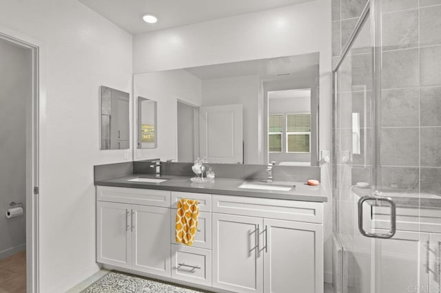 2035 Bravo Loop Unit 6, Chula Vista, CA 91915 - full bathroom featuring double vanity, a shower stall, and tile patterned floors