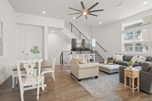 2035 Bravo Loop Unit 6, Chula Vista, CA 91915 - living room featuring a ceiling fan, wood finished floors, stairs, and recessed lighting