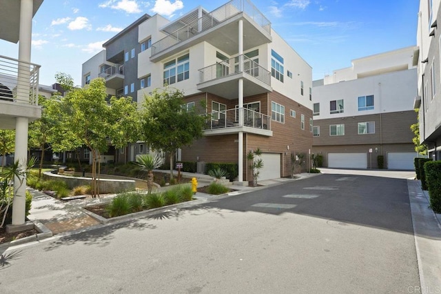 2035 Bravo Loop Unit 6, Chula Vista, CA 91915 - view of property with driveway and a garage