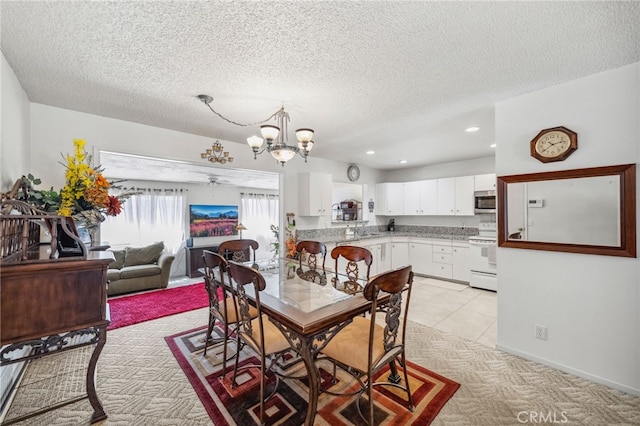 621 Shasta Way, Hemet, CA 92543 - dining room featuring a chandelier, light colored carpet, a textured ceiling, and recessed lighting