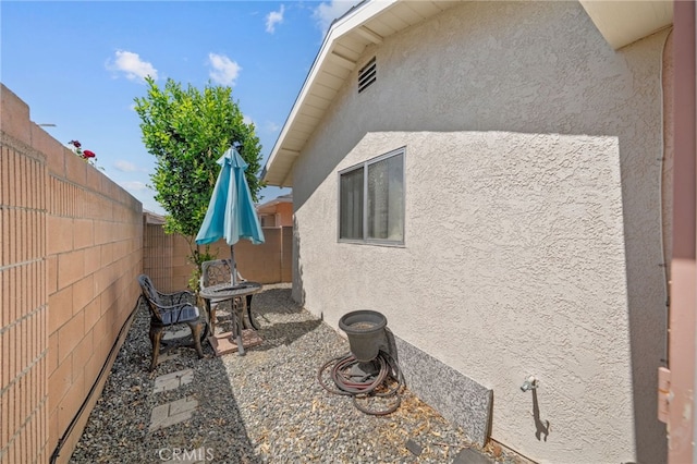 621 Shasta Way, Hemet, CA 92543 - view of side of property with stucco siding, a fenced backyard, and a patio