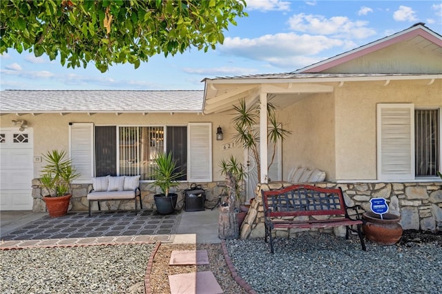 621 Shasta Way, Hemet, CA 92543 - doorway to property featuring stone siding, stucco siding, an outdoor hangout area, and a patio